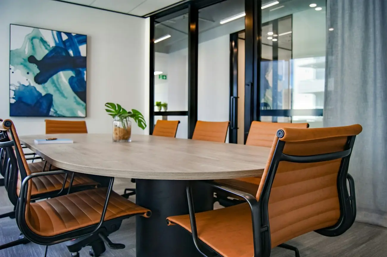 A bright Dubai boardroom with leather chairs