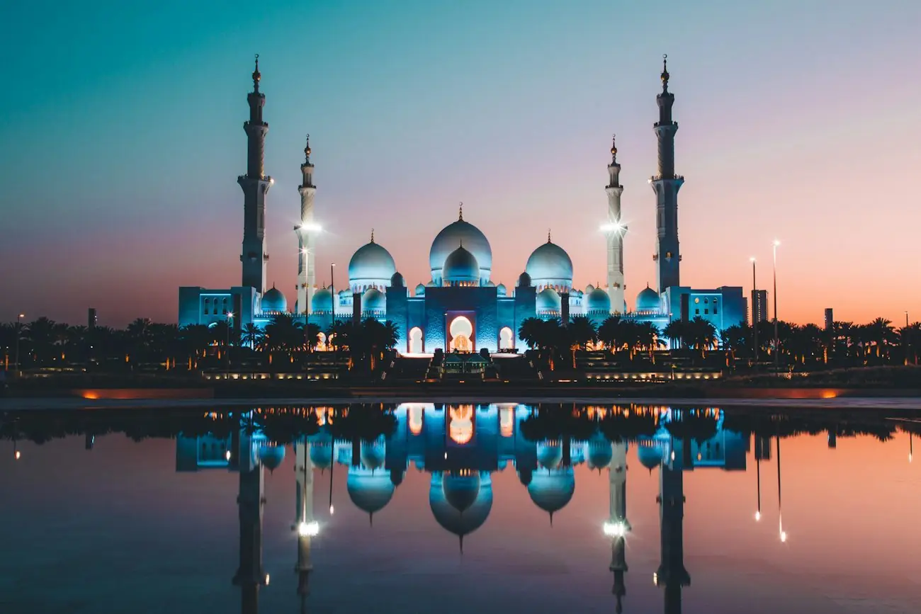 Sheikh Zayed Grand Mosque reflected at dusk