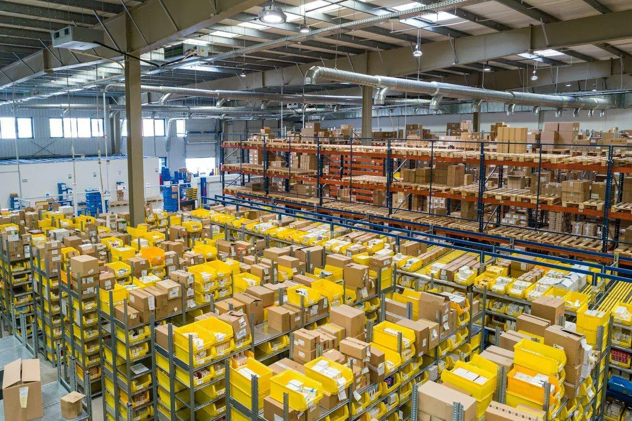 A warehouse with racks of boxed stock